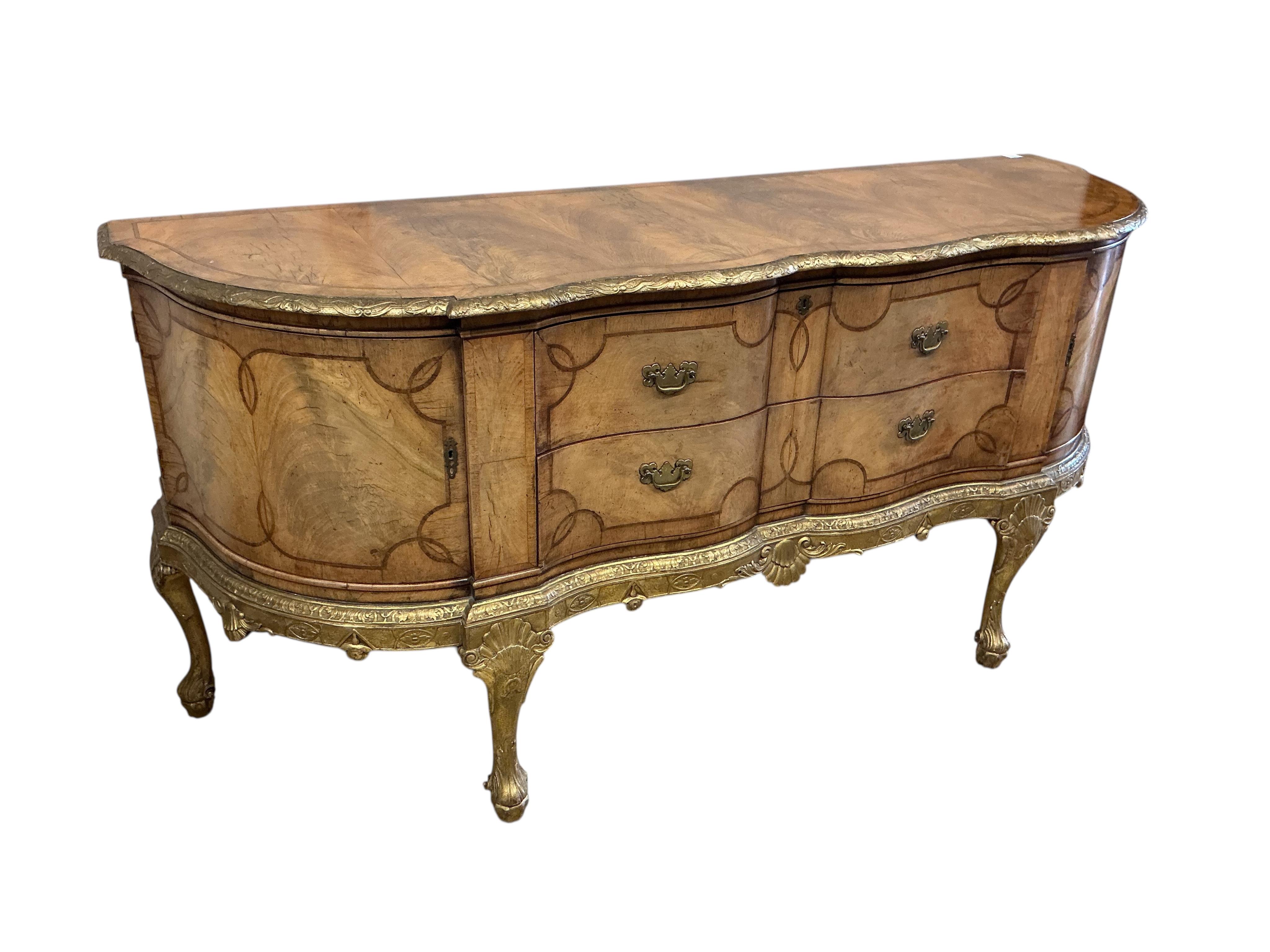 A George I style parcelgilt walnut shaped front sideboard, width 196cm, depth 60cm, height 92cm